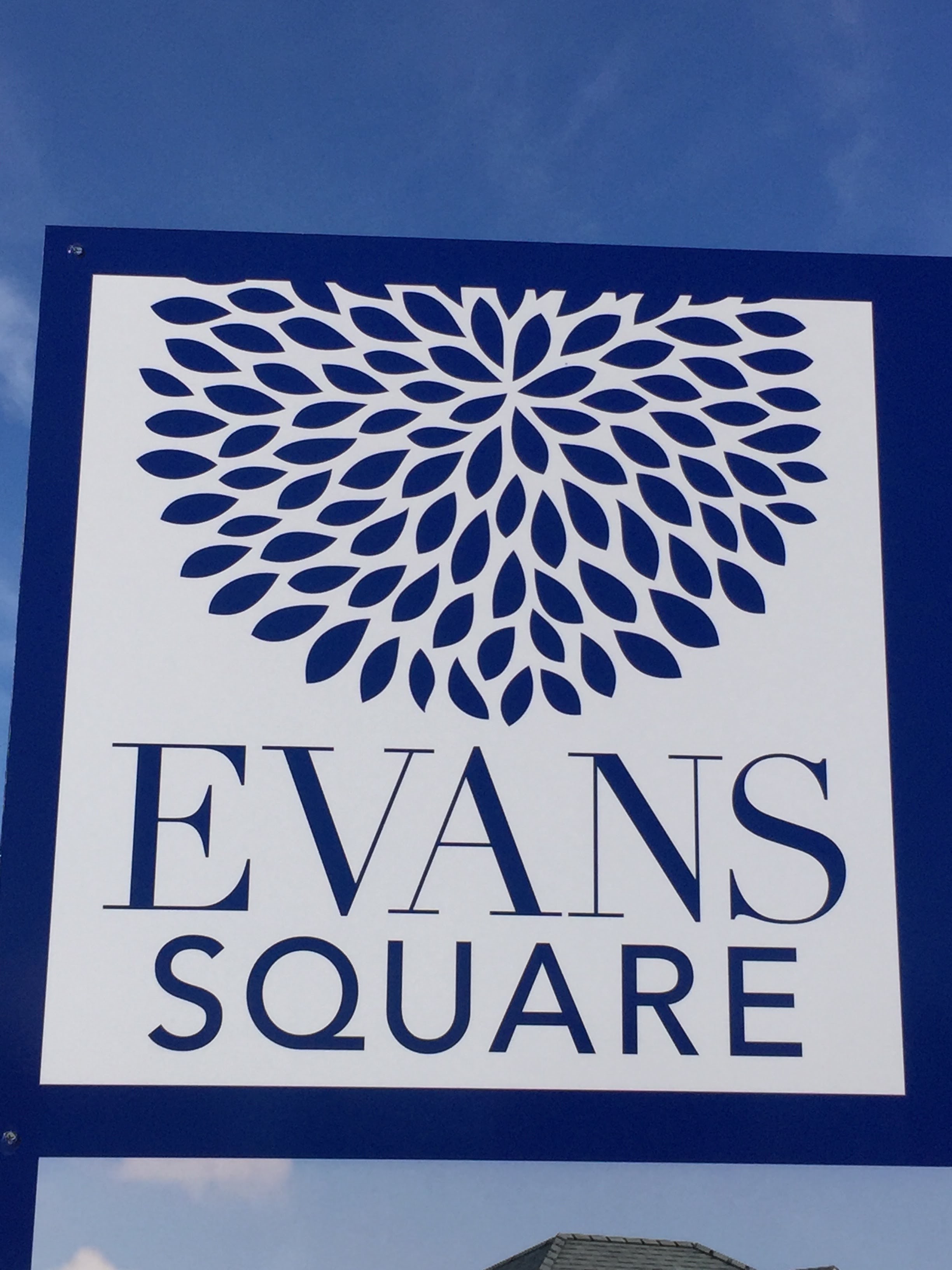 Entrance sign at Evans Square in Oviedo, Florida, marking a residential development built on former Evans family land